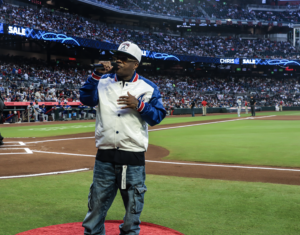 Jermaine Dupri is on the pitcher's mound at the Atlanta Braves stadium